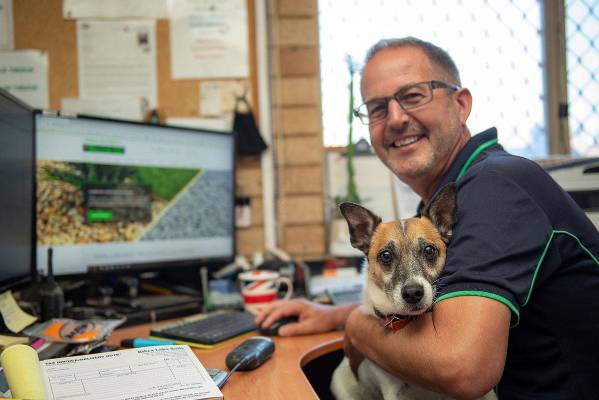Owner and dog of Bibra Lake Soils in office